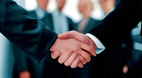 Professional business handshake symbolizing partnership with Cyber Aliens best company for educational institutes in Auckland New Zealand.