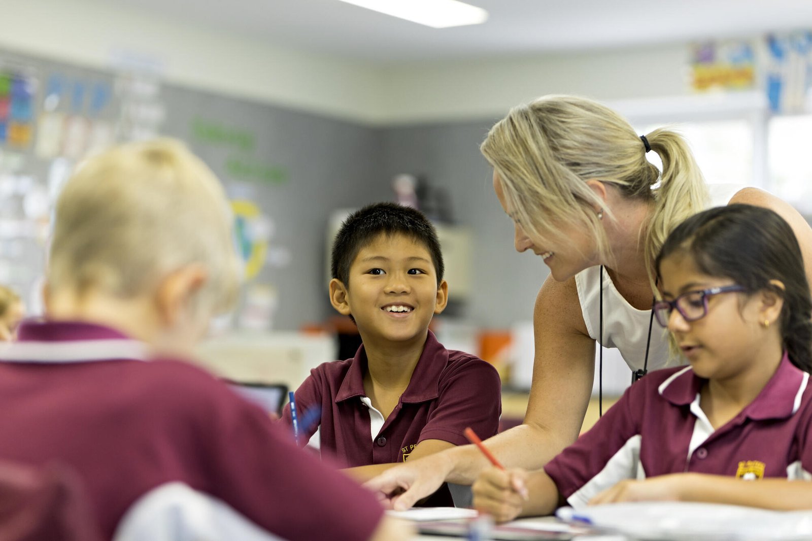 Teacher guiding students in classroom supported by Cyber Aliens best company for educational institutes in Auckland New Zealand.