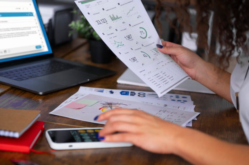 A user processing a transaction on a laptop with a credit card, demonstrating a secure e-commerce payment gateway integration by Cyber Aliens.